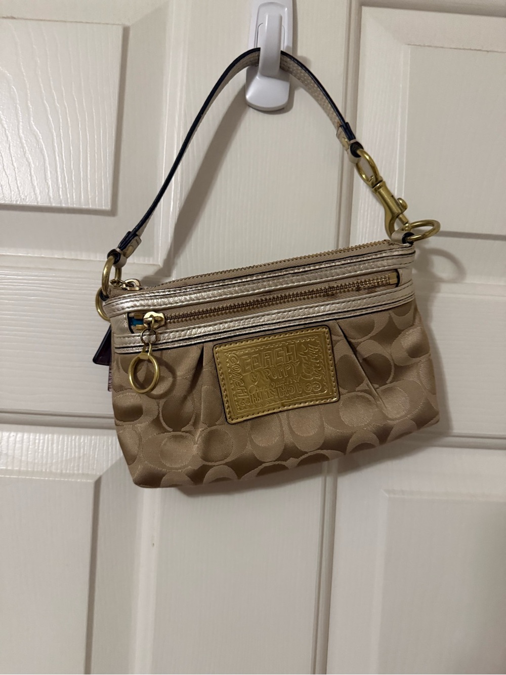 Coach Gold-Tone Signature Wristlet in Shimmering Beige